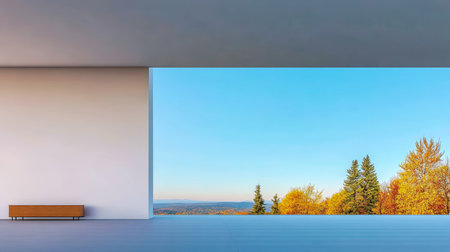 A spacious interior reveals a stunning autumn view with colorful trees and a clear blue sky. The minimalistic design highlights the natural beauty outside.の素材