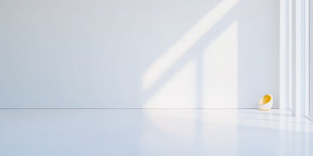 A minimal and bright room features white walls and floors, with natural light shining through large windows. A yellow vase adds a pop of color in the corner.の素材