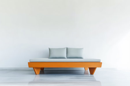 A sleek, modern sofa with light blue cushions sits in a spacious, bright room. The walls are white, creating a minimalist atmosphere suitable for stylish interior design.の素材