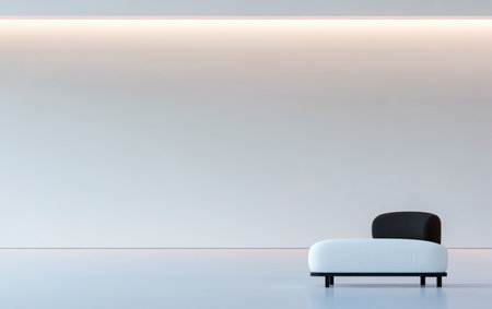 A sleek modern sofa featuring a black and white design rests in a minimalist room. Soft lighting highlights the clean lines and open space of the interior, creating a calm atmosphere.の素材
