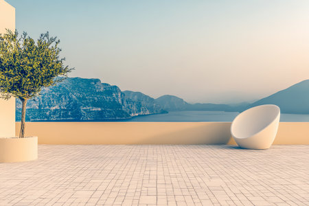 A beautifully designed terrace features a modern chair and a potted tree. The stunning landscape includes mountains and a serene body of water under a soft, warm light.の素材