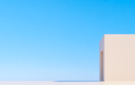 A simple geometric structure stands against a bright blue sky. The design features smooth walls and an open entrance, emphasizing minimalism and tranquility.の素材