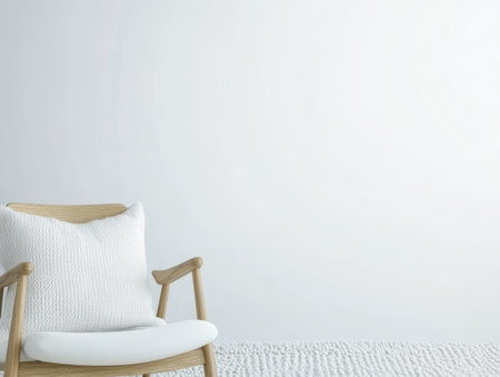 A modern chair made of light wood features a plush white cushion. It sits on a soft textured rug in a minimalist room with neutral-colored walls, creating a cozy atmosphere.の素材