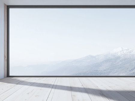A spacious room with a clean design has a large window that frames a winter landscape. Snow-capped mountains are visible, creating a calm atmosphere in the bright setting.の素材