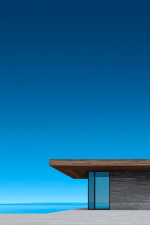 A sleek, modern house features a wooden overhang and large glass windows, set along a shoreline with tranquil waters under a bright blue sky.の素材