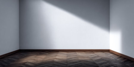 A minimalist corner of a room features elegant herringbone flooring and a wall that captures soft light during the late afternoon, creating a peaceful atmosphere.の素材