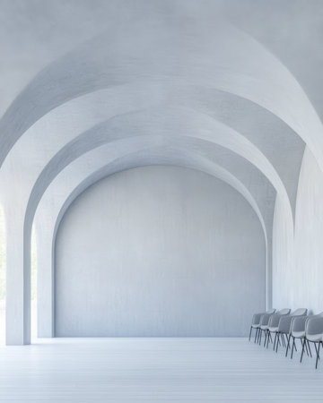 Bright room features elegant arches and a smooth floor, with a row of grey chairs against a light backdrop. The soft lighting enhances the serene atmosphere.の素材