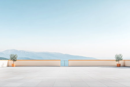A spacious terrace features two potted trees and overlooks distant mountains. The early morning sky is clear, creating a tranquil atmosphere perfect for relaxation.の素材