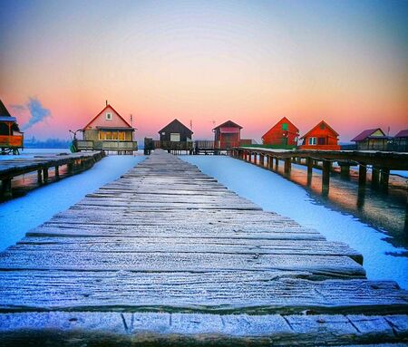 Frozen lake, pier and housesの素材