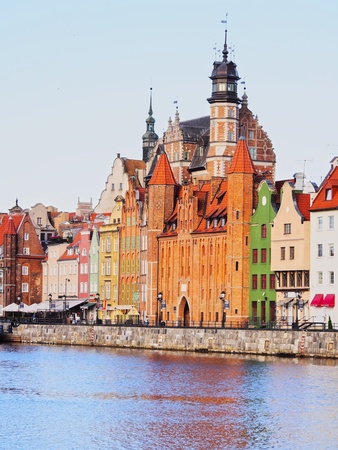 Cityscape of colorful houses in Gdansk reflecting in Moltawa River, Poland