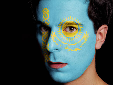 Flag of Kazakhstan Painted on a Face of a Young Man