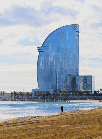 Surfing on Platja Sant Sebastia in Barcelona, Catalonia, Spainのeditorial素材
