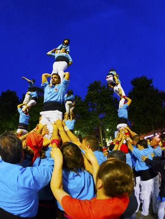 Castells Performance during the Festa Mayor 2013 in Terrassa, Catalonia, Spain. A castell is a human tower built traditionally in festivals at many locations within Catalonia.のeditorial素材