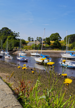 UK, Scotland, Lothian, Edinburgh Area, Cramond Village, Boats in the port at low tide.のeditorial素材