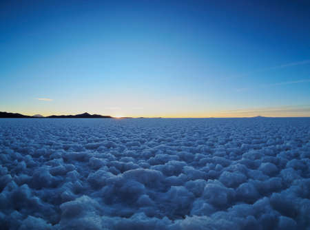 Bolivia, Potosi Department, Daniel Campos Province, View of the Salar de Uyuni, the largest salt flat in the world at sunset.の写真素材