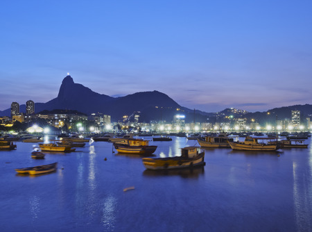 Brazil, City of Rio de Janeiro, Urca, Twilight view of Botafogo Bay and Corcovado Mountain.