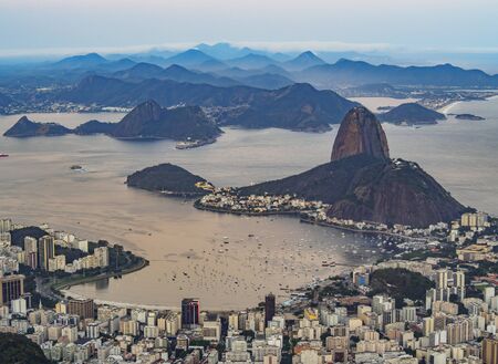 Brazil, City of Rio de Janeiro, Corcovado, Elevated view of the city with Sugarloaf Mountain and Guanabara Bay.の写真素材