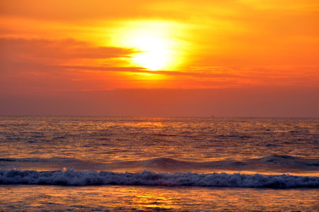 Patong beach sunset. Lots of colour here in this sky as the sun sinks into the Andaman Sea, off Phuket Island, Thailandの写真素材