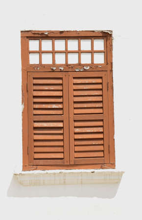 A well-maintained wooden window of an old  historic building in the island of Penang, Malaysia