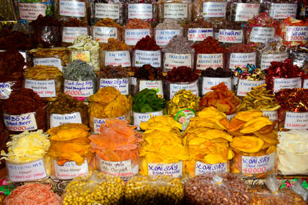 Market products. Products in bright colours on display and for sale here on a market in Ho Chi Minh City, Vietnamのeditorial素材