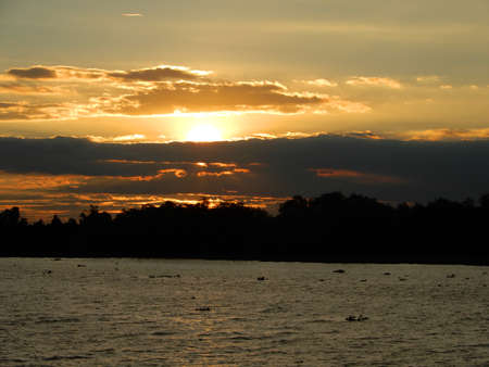 Sunset.  Lots of colour here in this sky over the river Mekong in Vietnamの写真素材