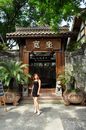 Chinese doorway. Carved out of wood and stone, this entrance is to an historical building in Cheng Du, Chinaのeditorial素材