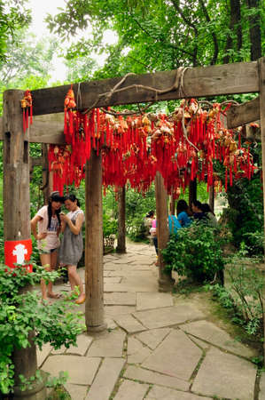 Good luck tree. Good fortune may come to those who hang a tassel on this tree and its extensions, here in Cheng Du, Chinaのeditorial素材