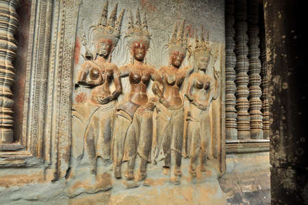 Carvings. One of many sculptured works dotted around the vast Angkor complex, centuries old, here in Cambodiaのeditorial素材