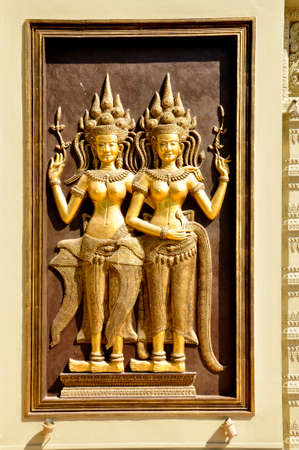Carvings. One of many sculptured works dotted around the vast Angkor complex, centuries old, here in Cambodiaの写真素材