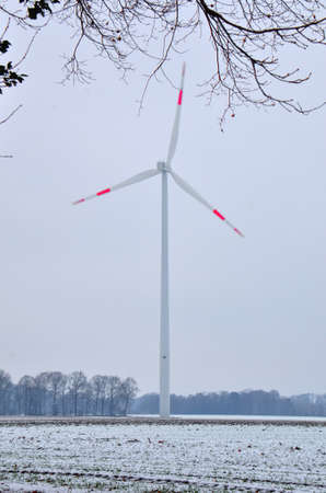 Tall wind generators producing renewable clean electrical energy, here in the German countrysideの写真素材