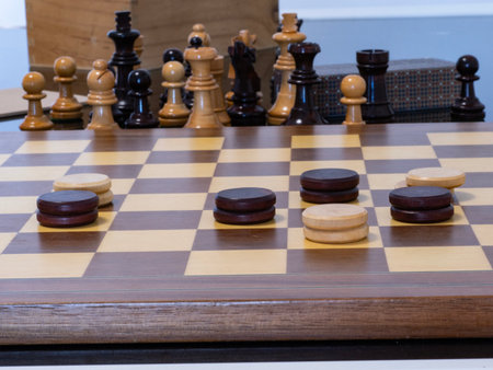 Wooden chess pieces on a chessboard. Close-up.