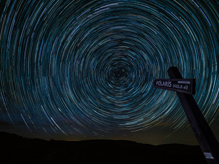 Star trails in the night sky. Long exposure photograph with grain.の写真素材