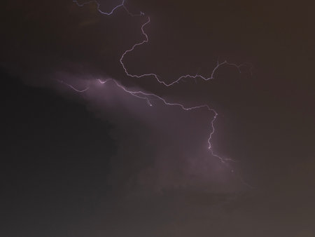 Lightning in the night sky, close-up. Abstract nature background