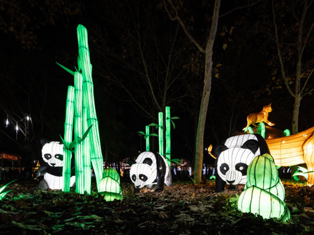 Unidentified people with giant panda statue at a festival in Chiang Mai, Thailand.