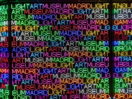 Background of colorful neon lights in the shape of the words of different languages