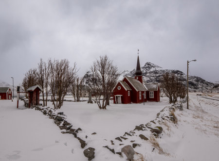 Traditional Norwegian red wooden church in winter, Lofoten islands, Norwayの写真素材