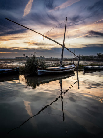 Boats on the water at sunsetの写真素材