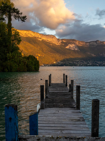Wooden pier on Lake Garda at sunset, Italyの写真素材