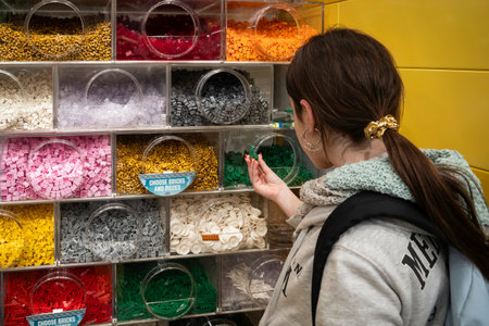 Unidentified woman looking at a display of colorful beads in a shop in Barcelonaの写真素材