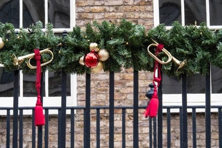 Christmas decoration on the iron gate of a house in London, UK
