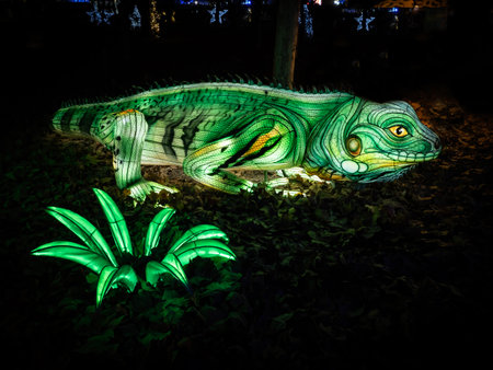 Neon chameleon in the garden with green palm leafs