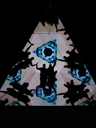 Silhouette of a group of people dancing in the night club