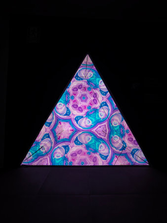 Colorful abstract pattern in the form of a triangle on a black backgroundの写真素材