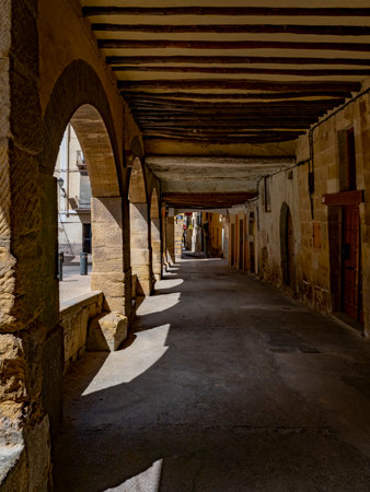 View of an arched passageway in a historic town in Spainの写真素材