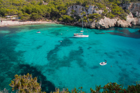 Aerial view of Cala Paradiso bay with boatsの写真素材