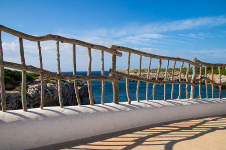 View of the sea from the stairs to the beach in Ibizaの写真素材