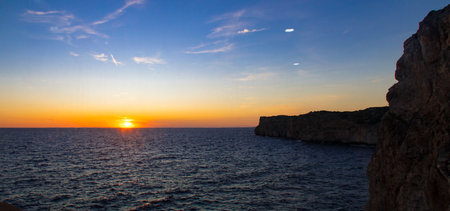 sunset over the sea in the island of Zakynthos Greeceの写真素材