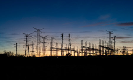 High-voltage power lines at sunset, closeup of photo