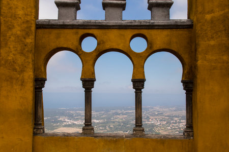 Detail of an architectural feature with a view of a cityscape.の写真素材