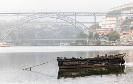 Old wooden boat on Douro river in Porto, Portugal.